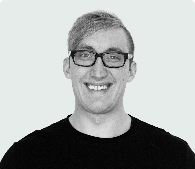 Headshot of James Love, smiling and wearing glasses.